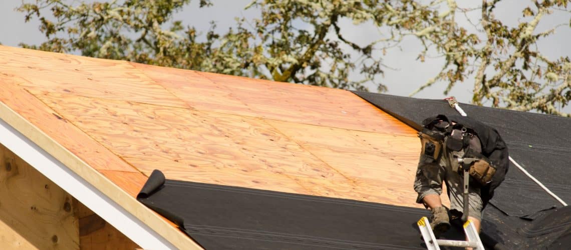 A roofer lays underlayment - best roofing company in baltimore county md - Home Crafters Roofing & Contractors